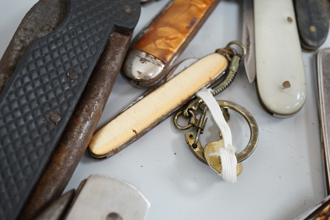 A collection of assorted penknives and whistles